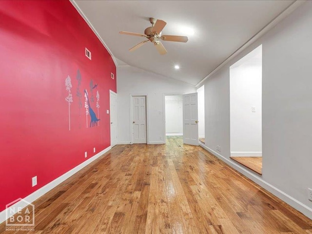 1005 Fairway, Jonesboro, AR 72401 - unfurnished room with wood-type flooring, a ceiling fan, lofted ceiling, and baseboards