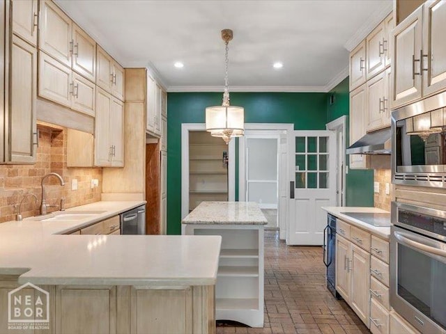 1005 Fairway, Jonesboro, AR 72401 - kitchen featuring stainless steel appliances, a sink, decorative backsplash, brick flooring, and a chandelier