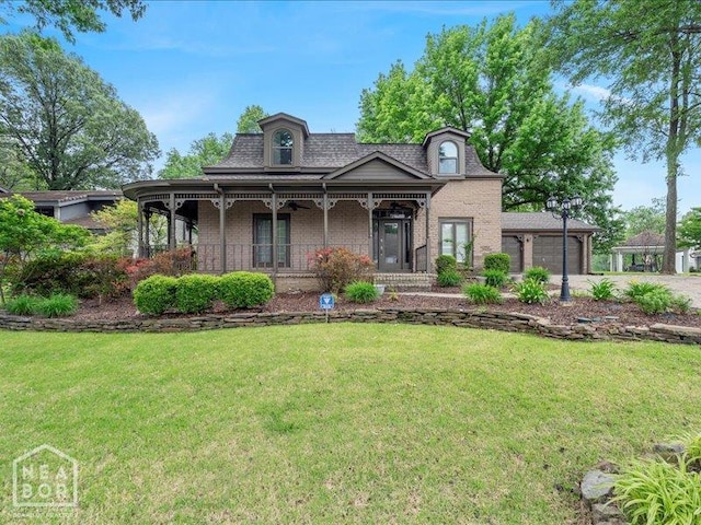 1005 Fairway, Jonesboro, AR 72401 - view of front of property with covered porch, a front lawn, a garage, driveway, and brick siding