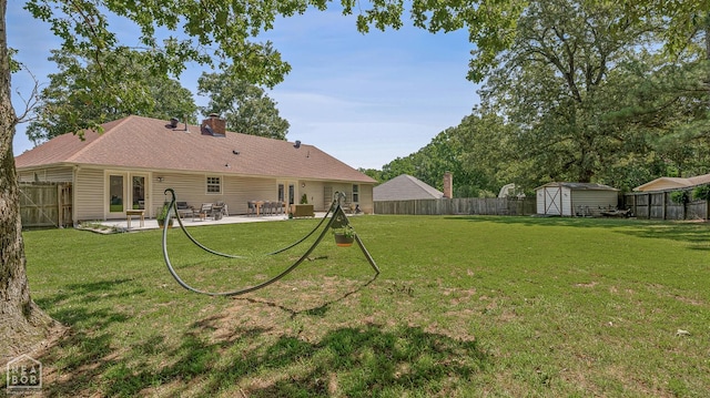 603 Arrowhead Dr, Jonesboro, AR 72401 - back of house with a patio area and a chimney