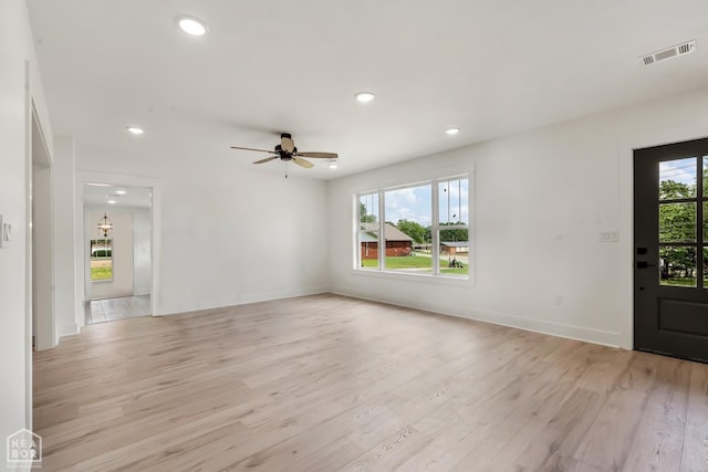 unfurnished living room featuring ceiling fan, visible vents, baseboards, recessed lighting, and light wood-style flooring