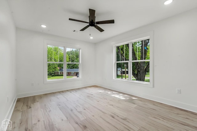 spare room with baseboards, a ceiling fan, recessed lighting, and wood finished floors