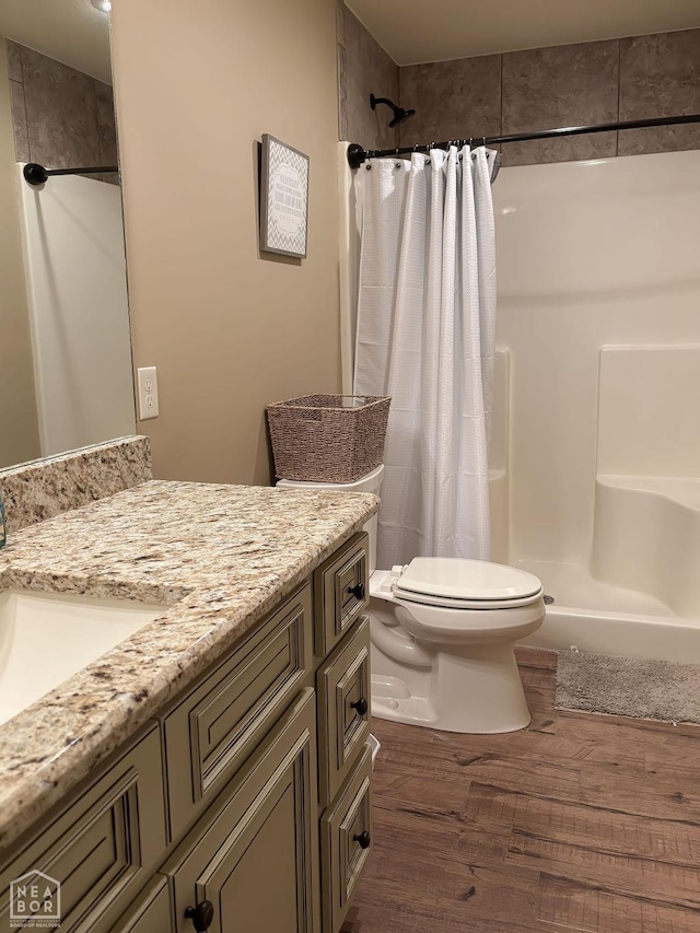 4228 Villa Cv, Jonesboro, AR 72405 - full bath with wood finished floors, a shower stall, toilet, and vanity