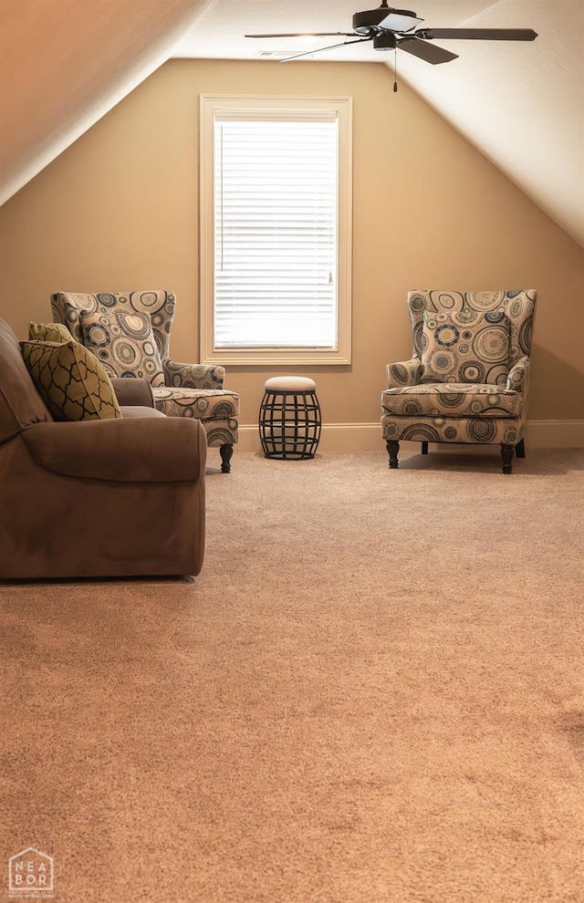 sitting room featuring baseboards, carpet floors, vaulted ceiling, and ceiling fan