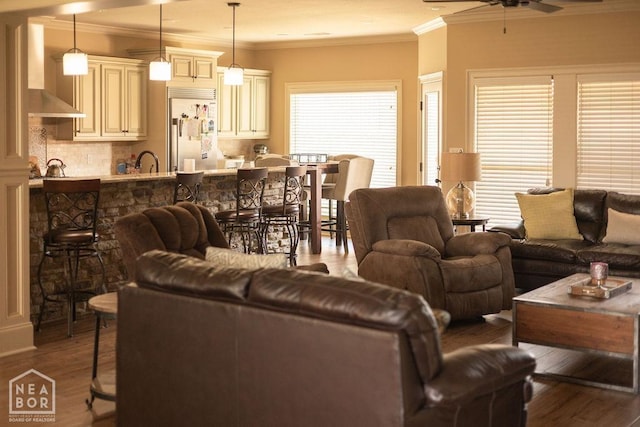 4228 Villa Cv, Jonesboro, AR 72405 - living area featuring ornamental molding, ceiling fan, and wood finished floors
