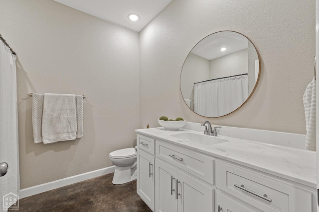 bathroom featuring recessed lighting, vanity, baseboards, and toilet