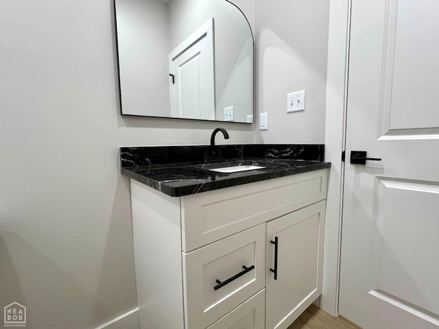 1217 Stella Ln, Trumann, AR 72472 - bathroom with vanity and wood finished floors