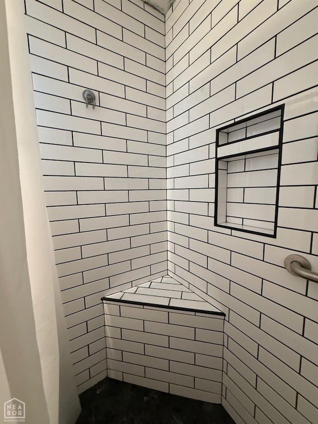 bathroom featuring tiled shower