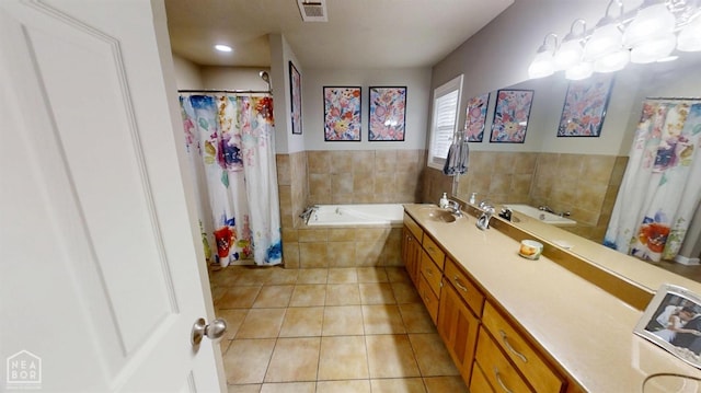 full bathroom featuring tile patterned floors, a garden tub, vanity, and visible vents