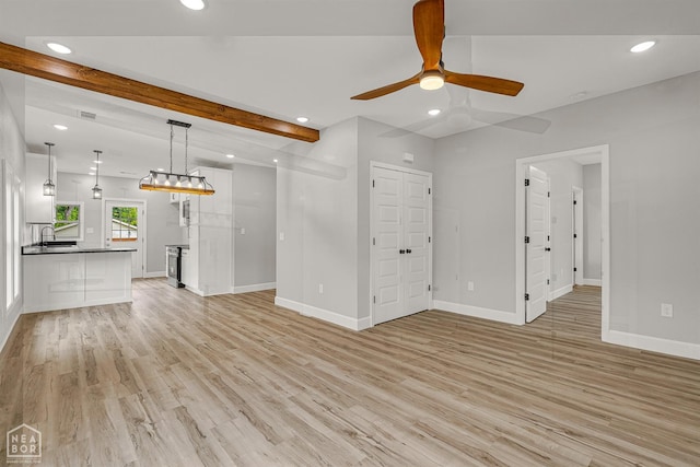617 S 7th St, Paragould, AR 72450 - unfurnished living room with ceiling fan, baseboards, recessed lighting, light wood-type flooring, and a sink