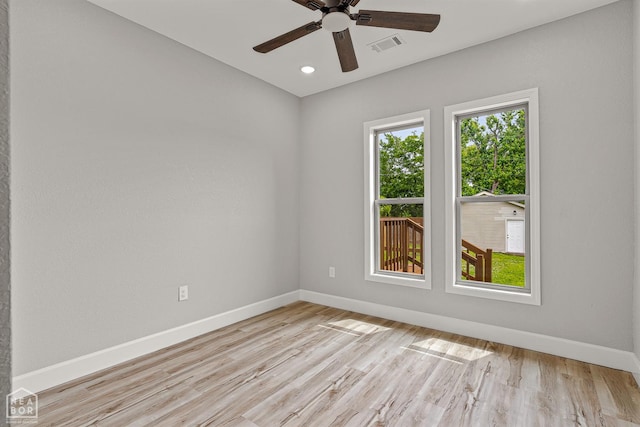 617 S 7th St, Paragould, AR 72450 - spare room featuring baseboards, a ceiling fan, light wood-type flooring, and recessed lighting