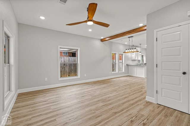 617 S 7th St, Paragould, AR 72450 - unfurnished living room with light wood finished floors, recessed lighting, baseboards, and ceiling fan