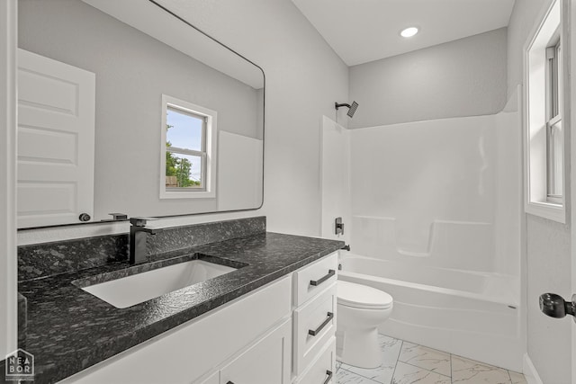 617 S 7th St, Paragould, AR 72450 - bathroom with marble finish flooring, toilet,  shower combination, vanity, and recessed lighting