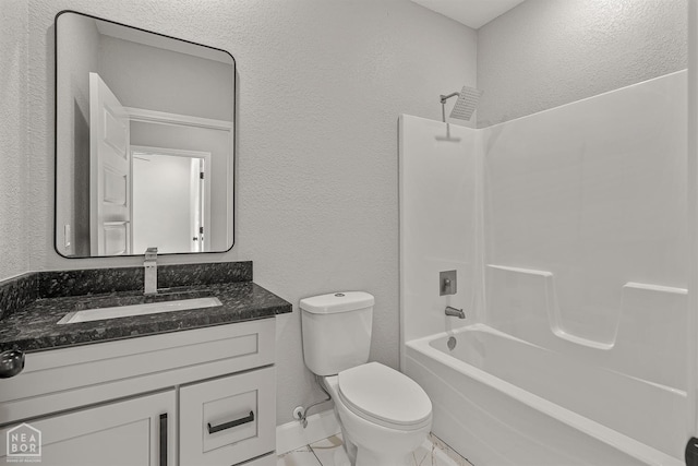 617 S 7th St, Paragould, AR 72450 - full bath featuring a textured wall, toilet, shower / bathtub combination, vanity, and baseboards