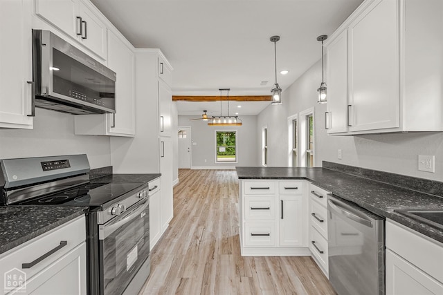 617 S 7th St, Paragould, AR 72450 - kitchen with appliances with stainless steel finishes, light wood-style floors, white cabinets, and recessed lighting