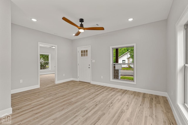 617 S 7th St, Paragould, AR 72450 - unfurnished living room with plenty of natural light, ceiling fan, light wood finished floors, baseboards, and recessed lighting