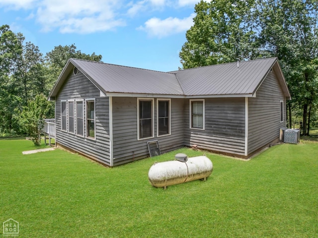 200 Law 296 Rd, Black Rock, AR 72415 - rear view of property with a yard and a metal roof