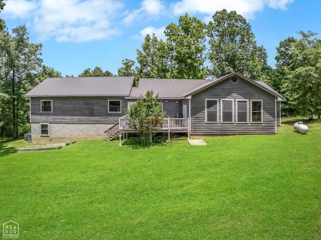 200 Law 296 Rd, Black Rock, AR 72415 - rear view of property featuring a deck, a yard, and a metal roof
