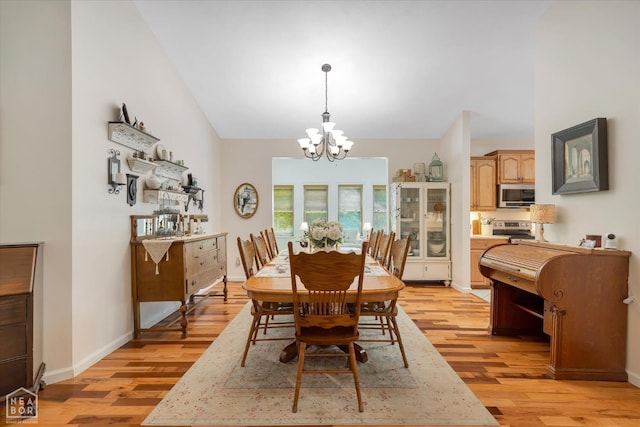 200 Law 296 Rd, Black Rock, AR 72415 - dining space with a chandelier, light wood-style floors, and lofted ceiling