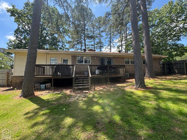 900 Sycamore Cv, Jonesboro, AR 72404 - rear view of property featuring brick siding and a wooden deck