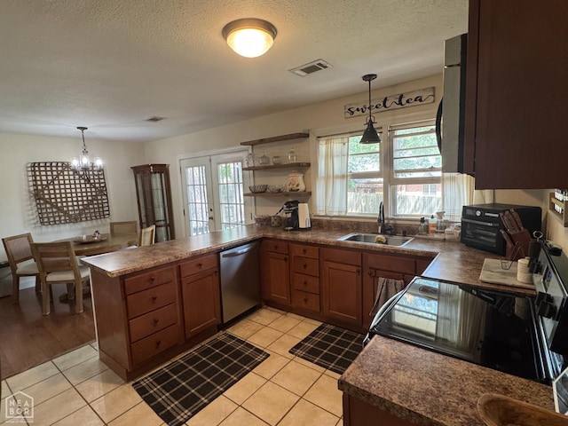 900 Sycamore Cv, Jonesboro, AR 72404 - kitchen with dishwasher, dark countertops, a sink, a chandelier, and range