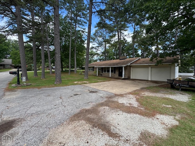 900 Sycamore Cv, Jonesboro, AR 72404 - view of front of home with a garage, driveway, and a front lawn