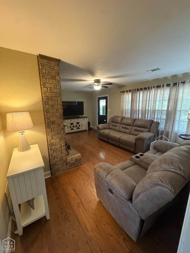 900 Sycamore Cv, Jonesboro, AR 72404 - living room featuring a ceiling fan, wood finished floors, and baseboards