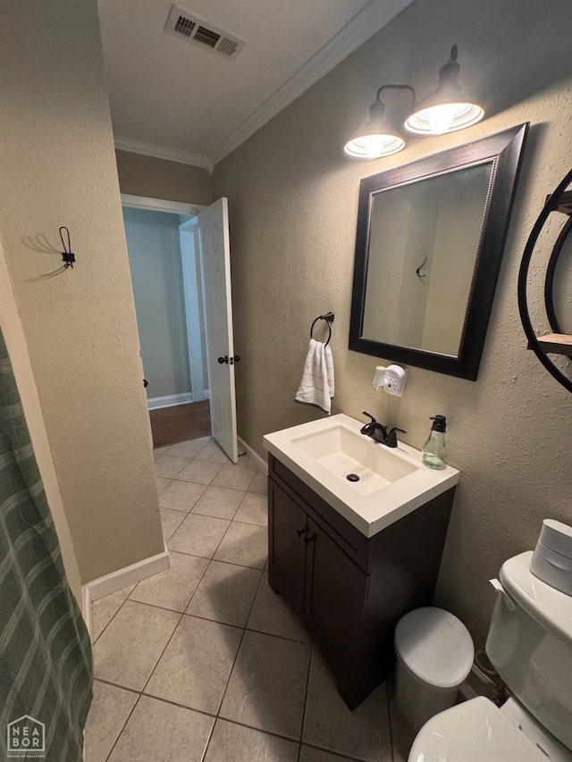900 Sycamore Cv, Jonesboro, AR 72404 - bathroom featuring ornamental molding, tile patterned floors, vanity, toilet, and baseboards