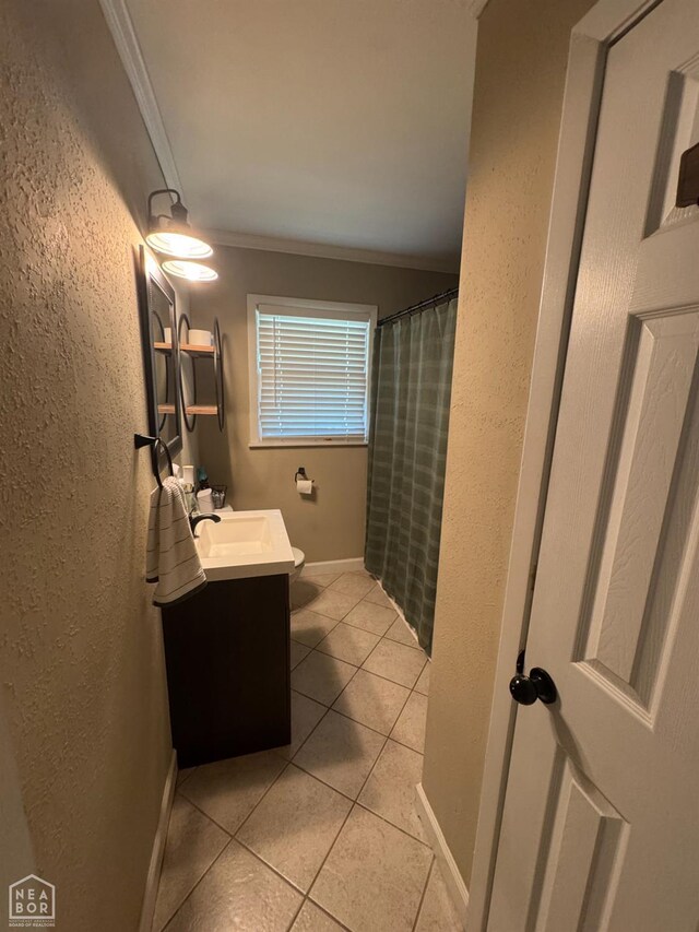 900 Sycamore Cv, Jonesboro, AR 72404 - bathroom featuring ornamental molding, vanity, tile patterned floors, a textured wall, and toilet