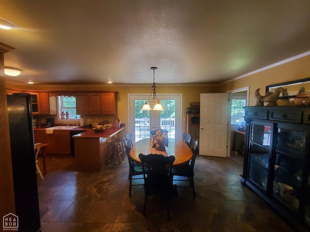2590 W N St, Piggott, AR 72454 - dining space featuring healthy amount of natural light and crown molding