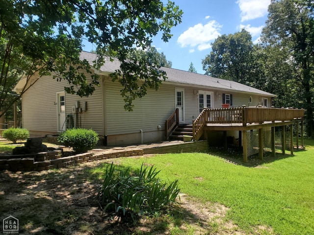 2590 W N St, Piggott, AR 72454 - rear view of property with a lawn, a wooden deck, and a shingled roof