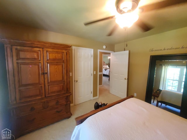2590 W N St, Piggott, AR 72454 - bedroom with light colored carpet and ceiling fan