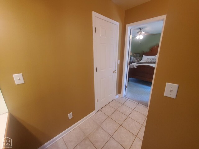 2590 W N St, Piggott, AR 72454 - hallway with light tile patterned floors and baseboards
