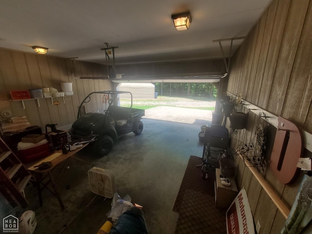 2590 W N St, Piggott, AR 72454 - garage featuring wooden walls