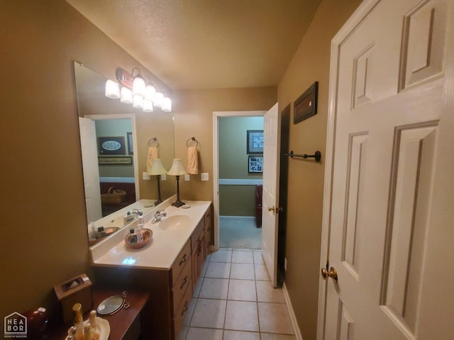 2590 W N St, Piggott, AR 72454 - bathroom with vanity and tile patterned flooring