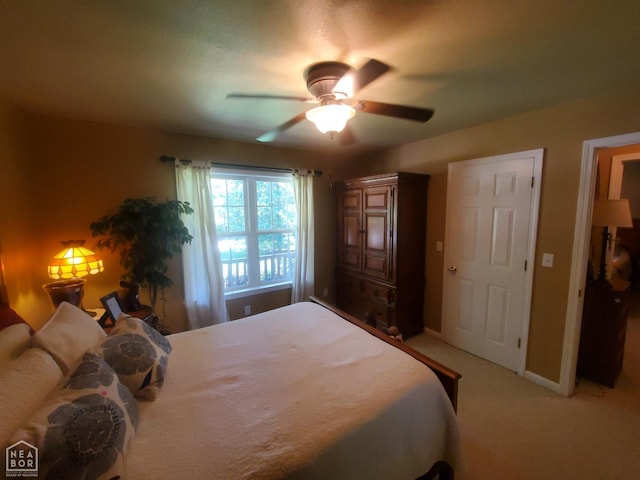 2590 W N St, Piggott, AR 72454 - bedroom featuring light colored carpet and ceiling fan