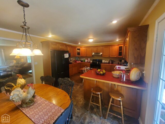 2590 W N St, Piggott, AR 72454 - kitchen with black appliances, under cabinet range hood, a peninsula, glass insert cabinets, and crown molding