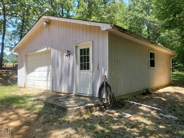 2590 W N St, Piggott, AR 72454 - view of side of property with an outdoor structure and a detached garage