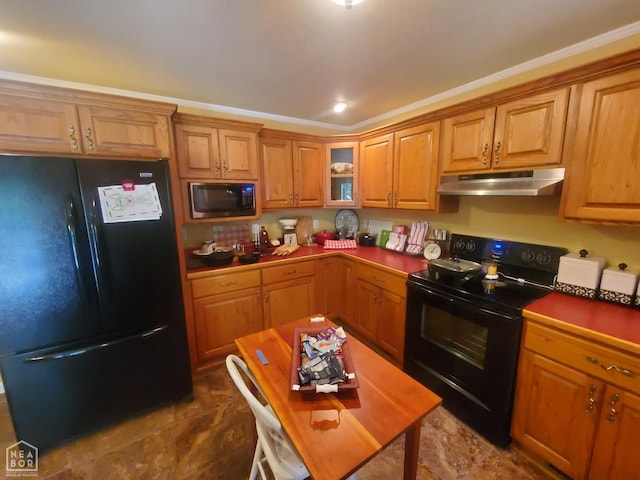 2590 W N St, Piggott, AR 72454 - kitchen with black appliances, under cabinet range hood, brown cabinetry, and glass insert cabinets