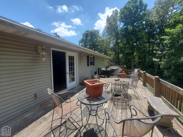 2590 W N St, Piggott, AR 72454 - wooden terrace featuring outdoor dining space