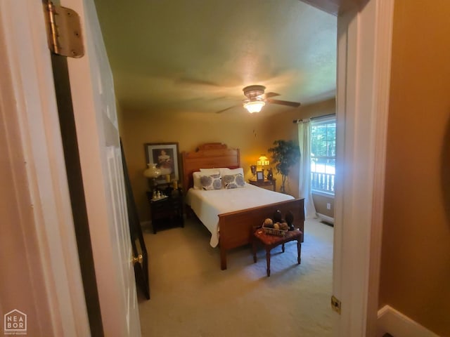 2590 W N St, Piggott, AR 72454 - carpeted bedroom with a ceiling fan