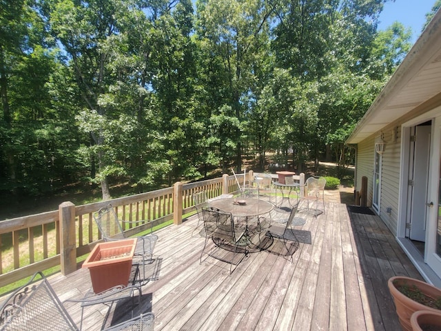2590 W N St, Piggott, AR 72454 - wooden terrace featuring outdoor dining space