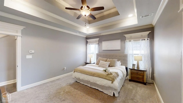6509 Merrell Dr, Jonesboro, AR 72404 - carpeted bedroom featuring ornamental molding, a tray ceiling, and ceiling fan