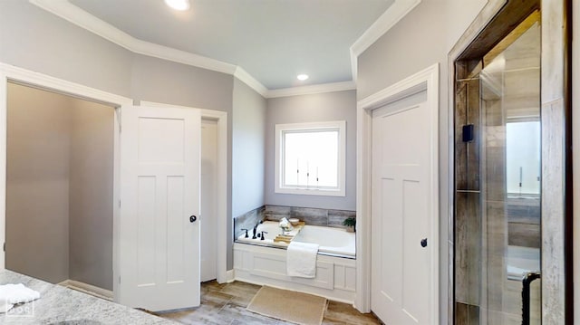 6509 Merrell Dr, Jonesboro, AR 72404 - bathroom featuring a garden tub, a stall shower, and crown molding