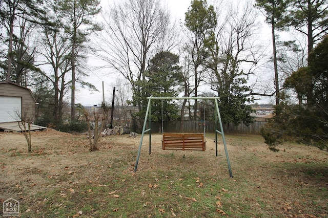 view of yard with an outdoor structure and fence