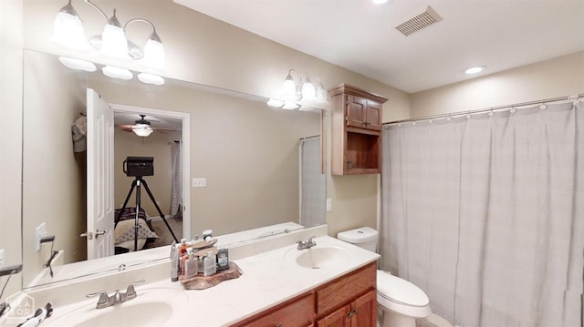 334 Linda St, Bono, AR 72416 - full bathroom with visible vents, a ceiling fan, a sink, and toilet