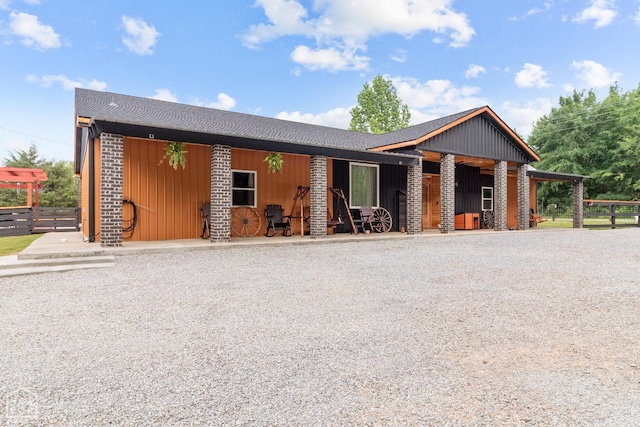 rustic home featuring an exterior structure and an outdoor structure