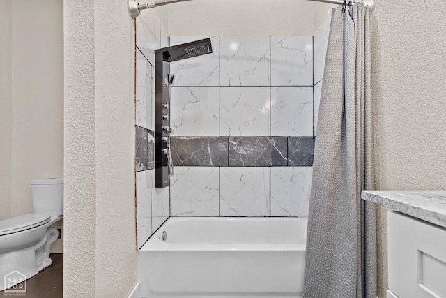 full bathroom with shower / tub combo, toilet, and a textured wall