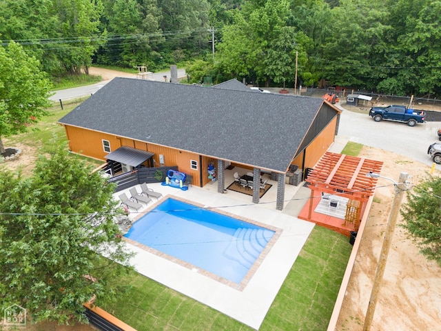 view of swimming pool featuring a fenced in pool and a patio