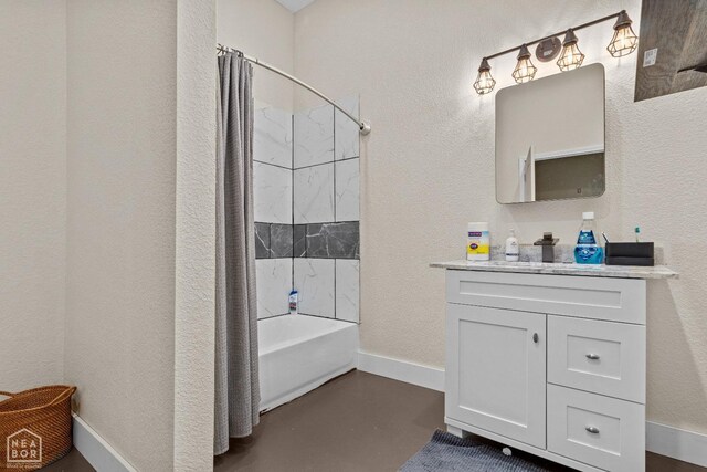 bathroom with concrete floors, vanity, baseboards, a textured wall, and shower / tub combo with curtain